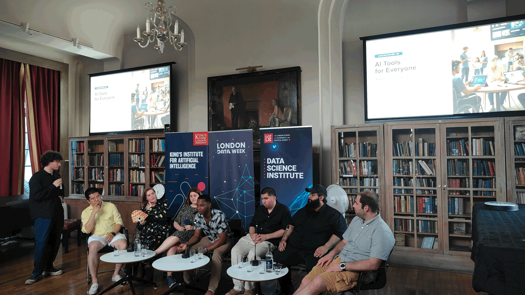 The speaker panel at Tesseract Academy's AI Tools for Everyone: Advancing Disability Inclusion event in the Shaw Library, LSE, with King's Institute for Artificial Intelligence, London Data Week and LSE Data Science Institute banners